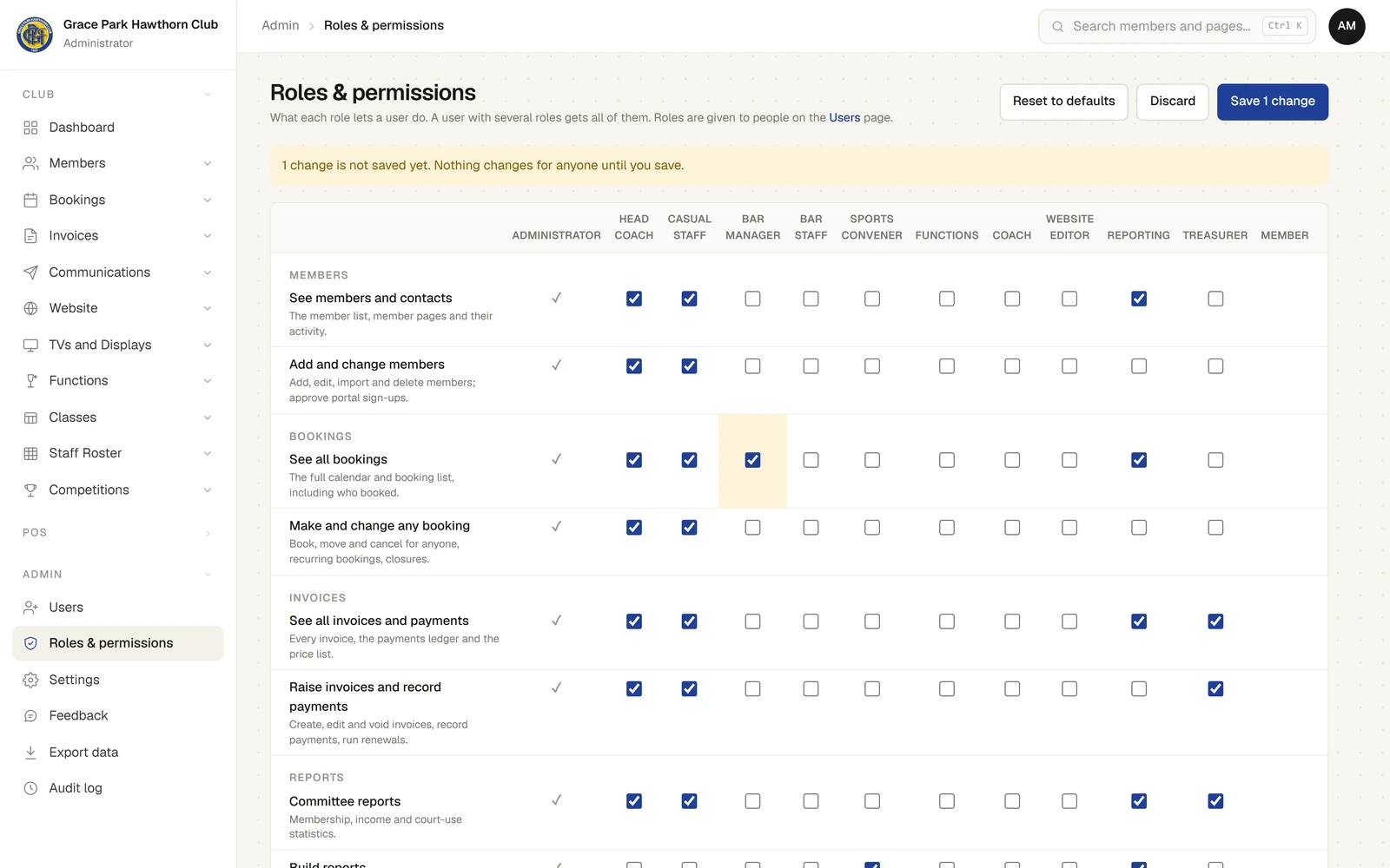 The Roles & permissions page with the Reset to defaults, Discard and Save 1 change buttons, a banner saying "1 change is not saved yet. Nothing changes for anyone until you save.", and the table: roles across the top, permissions down the side grouped by area. Under Bookings, See all bookings now has a tick for the Bar Manager.